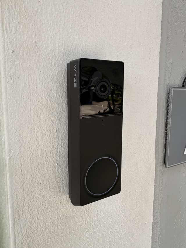 Video doorbell installed on stucco